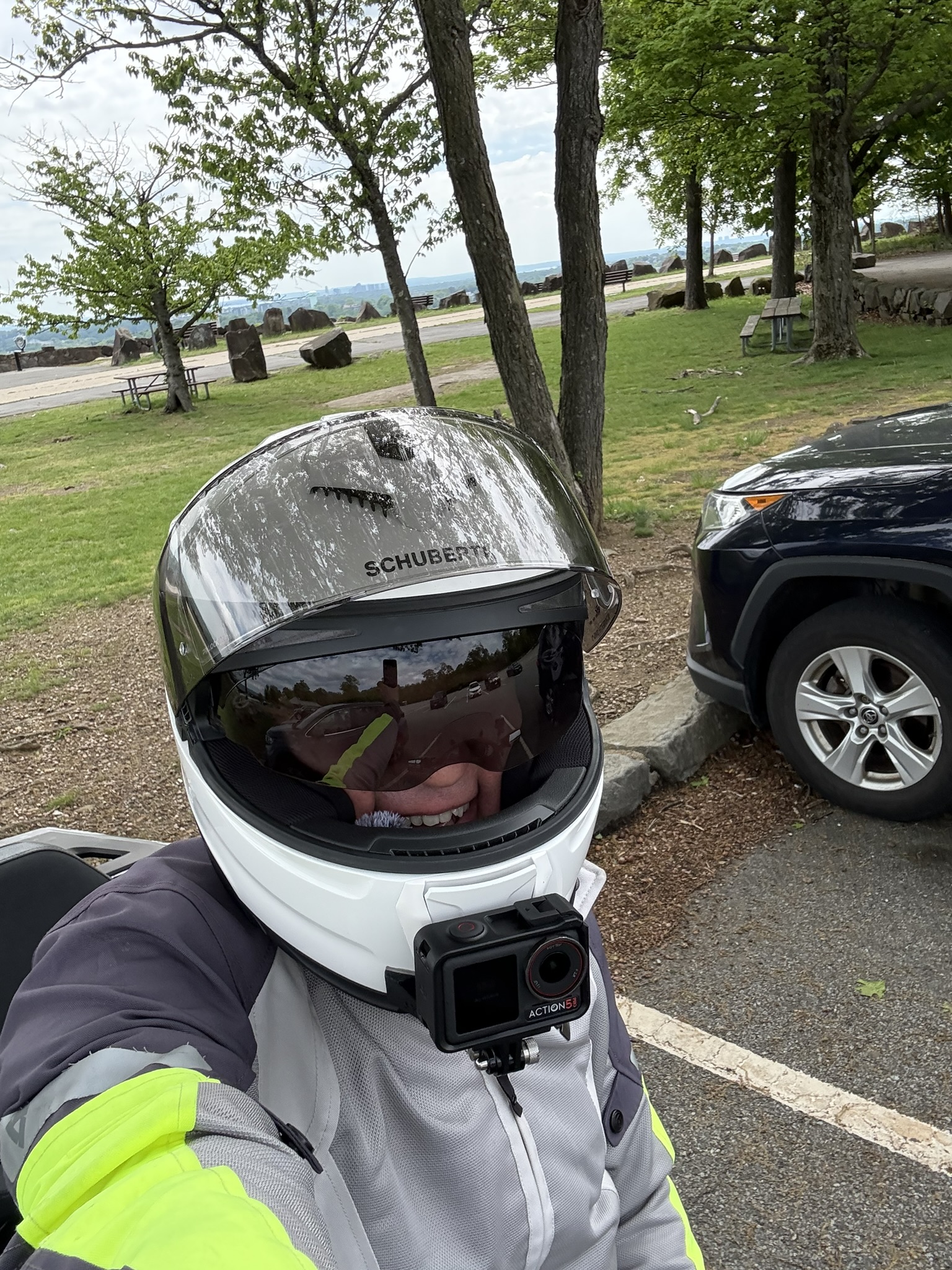 Dmitry, founder of RideMentor, geared up at a roadside overlook